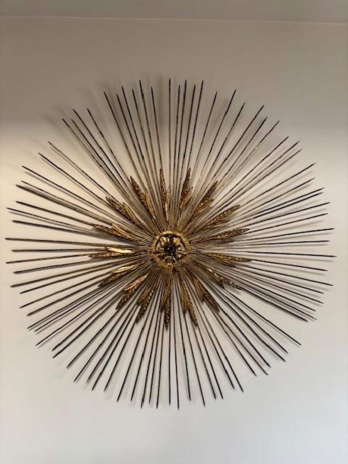 Mid centur gilt metal sunburst with wheat and spoke design